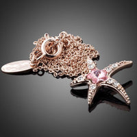 Close up detail of KHAISTA crystal starfish pendant necklace