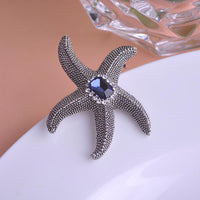 Starfish design detail on Khaista crystal brooch