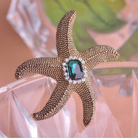 Close-up of crystals on Khaista starfish brooch