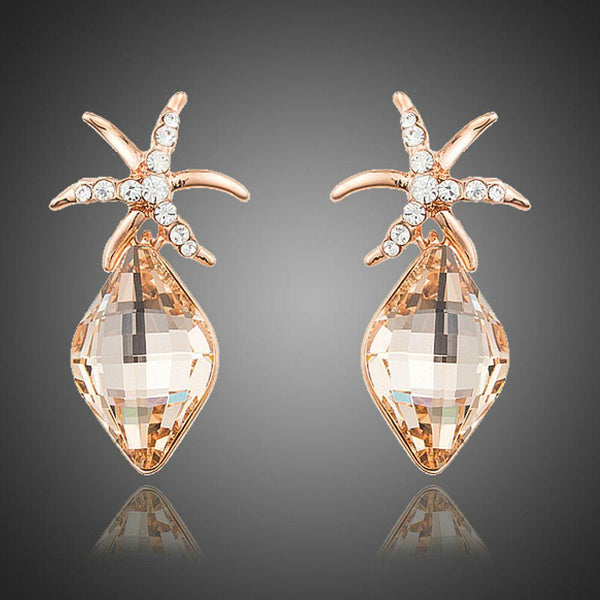 KHAISTA starfish rhinestone drop earrings on white background