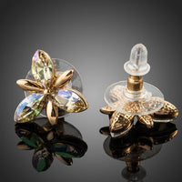 Side angle view of KHAISTA Stellux Austrian crystal flower stud earrings