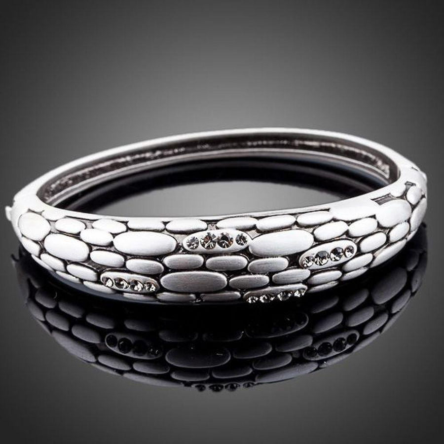 KHAISTA stone wall design crystal bangle on white background