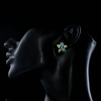 Side angle view of KHAISTA summer flower CZ stud earrings