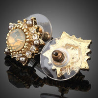 Close up of KHAISTA sunflower design crystal stud earrings