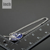 Pendant detail on KHAISTA swan crystal link chain necklace