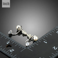 synthetic pearl stud earrings detail view by KHAISTA