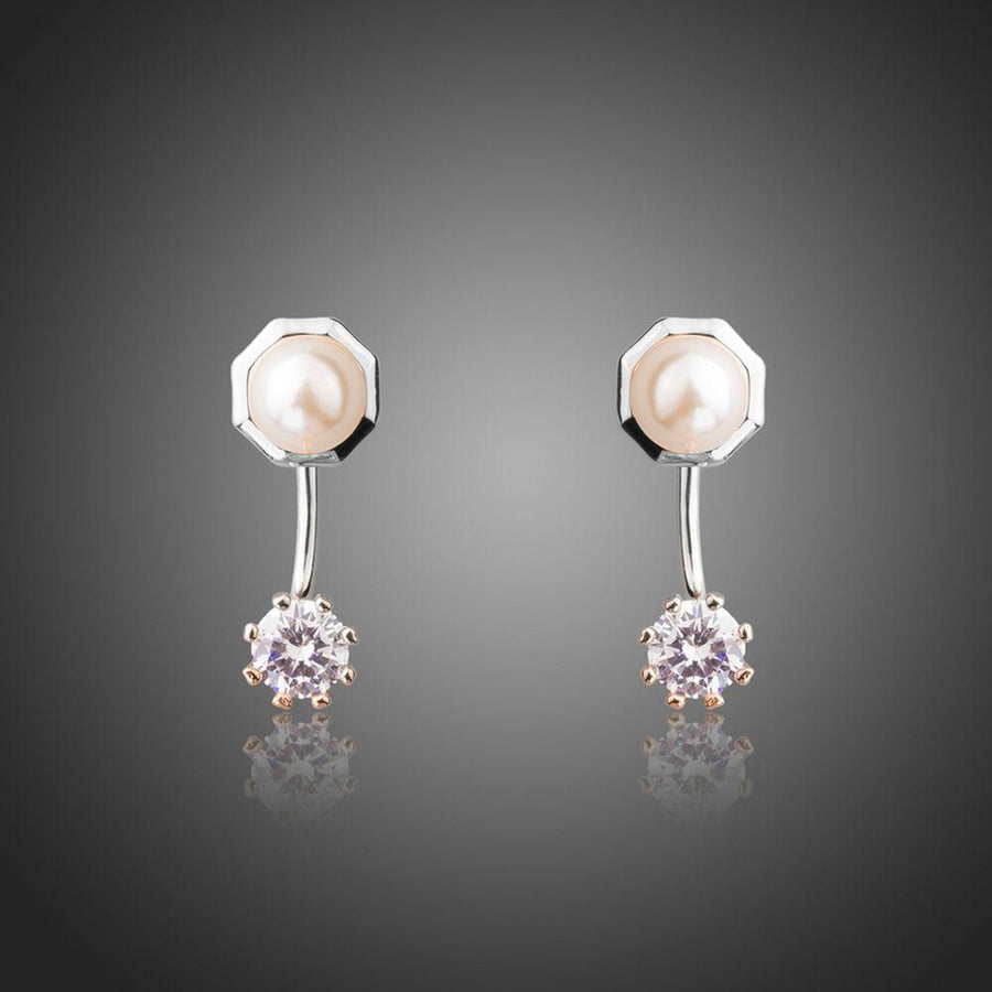 KHAISTA synthetic pearl stud earrings on white background