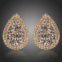 KHAISTA teardrop design crystal stud earrings on white background