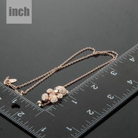 Pendant detail on KHAISTA champagne crystal teddy bear necklace