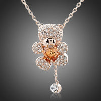 KHAISTA champagne crystal teddy bear necklace on white background