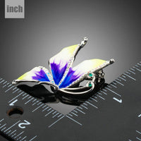 Close-up of rhinestones on Khaista white gold leaf brooch