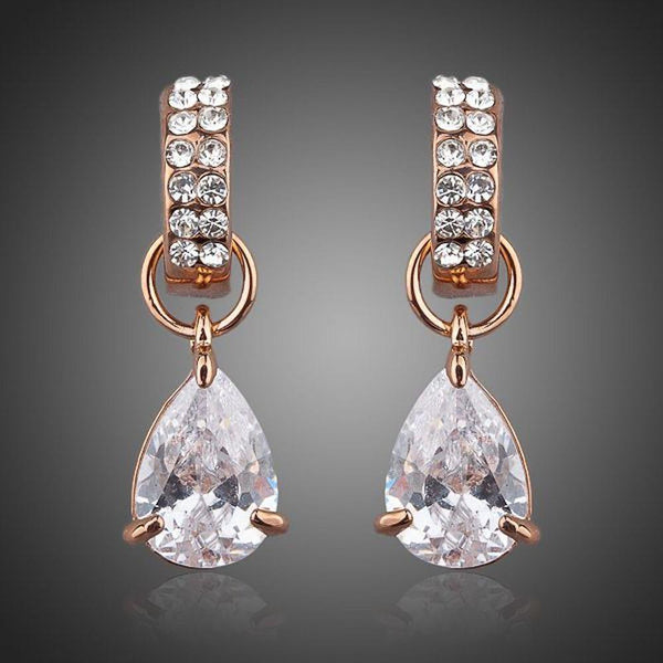 KHAISTA transparent CZ raindrop earrings on white background
