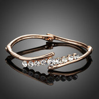 KHAISTA twist design crystal bangle on white background