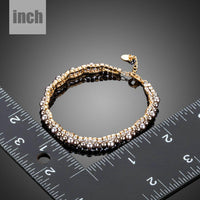 Side angle view of KHAISTA two row micro CZ bead bracelet