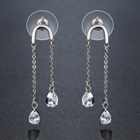 U-shape pear cut crystal earrings detail view by KHAISTA