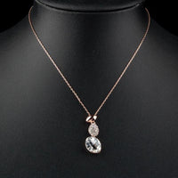 Side angle view of KHAISTA unique crystal pendant necklace