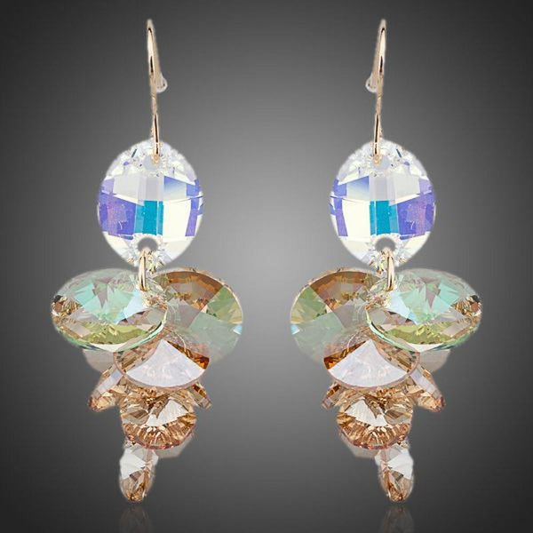 KHAISTA unique Stellux crystal drop earrings on white background