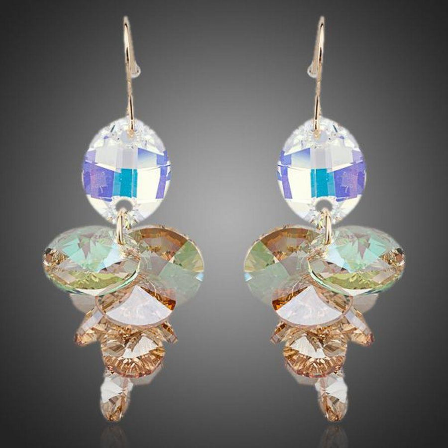 KHAISTA unique Stellux crystal drop earrings on white background