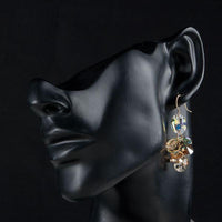 Close up of KHAISTA unique Stellux crystal drop earrings