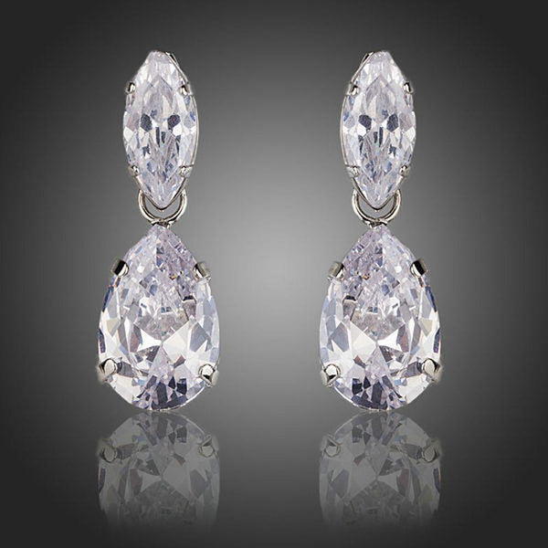 KHAISTA waterfall crystal drop earrings on white background