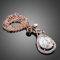 Close up detail of KHAISTA waterdrop peacock crystal pendant necklace