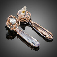 Close up of KHAISTA waterfall CZ drop earrings