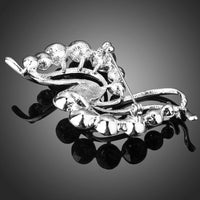 Close-up of crystals on Khaista wave scarf brooch