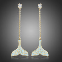 KHAISTA crystal whale fluke drop earrings on white background