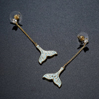 crystal whale fluke drop earrings detail view by KHAISTA