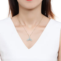 Close up detail of KHAISTA crystal whale fluke pendant necklace