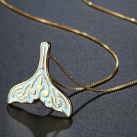 Pendant detail on KHAISTA crystal whale fluke pendant necklace