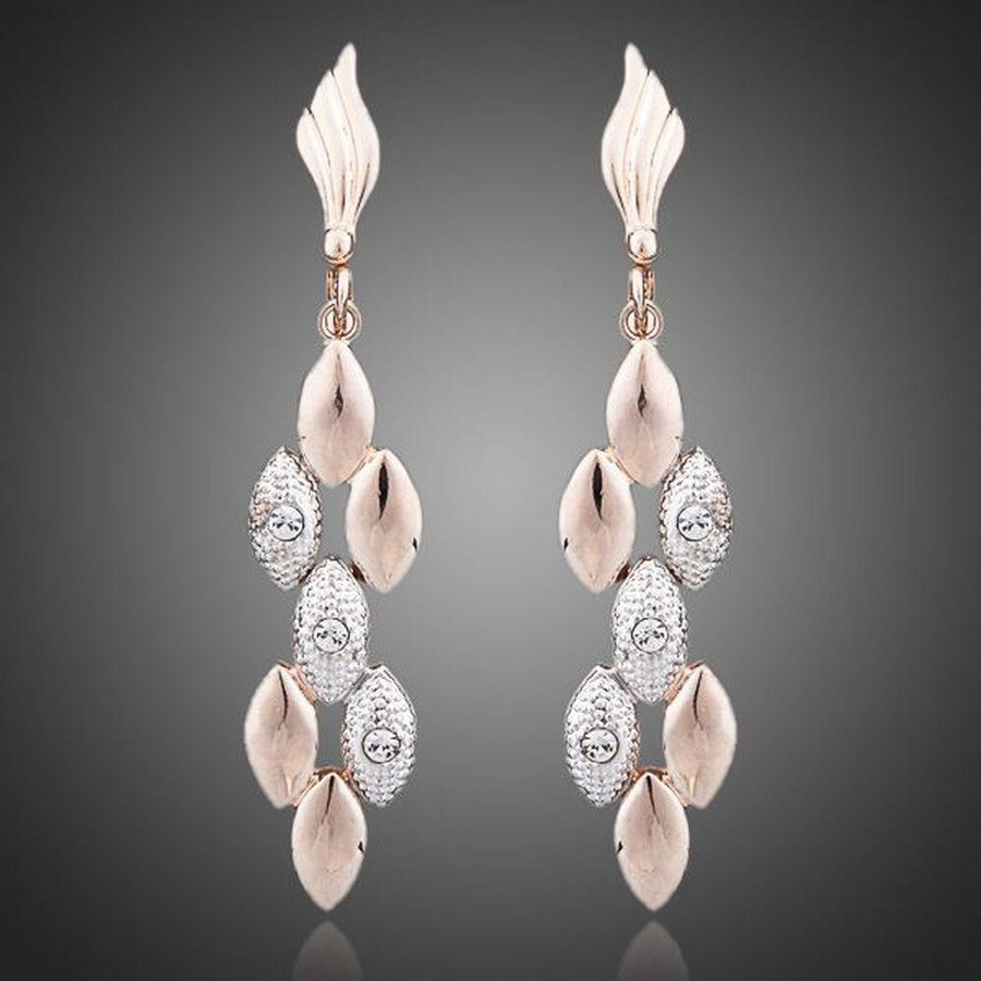 KHAISTA wheat design crystal drop earrings on white background