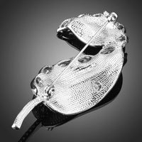 Banana leaf design detail on Khaista white crystal brooch