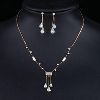 Side angle view of Khaista white waterdrop set