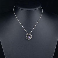 Close up detail of KHAISTA white gold crystal chain necklace