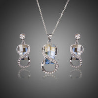 Khaista blue crystal white gold necklace earrings set on white background