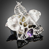 Flower design detail on KHAISTA purple CZ brooch