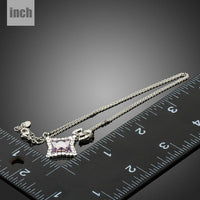 Pendant detail on KHAISTA white gold bow knot long chain necklace