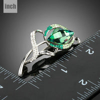 Close-up of green crystals on Khaista white gold brooch