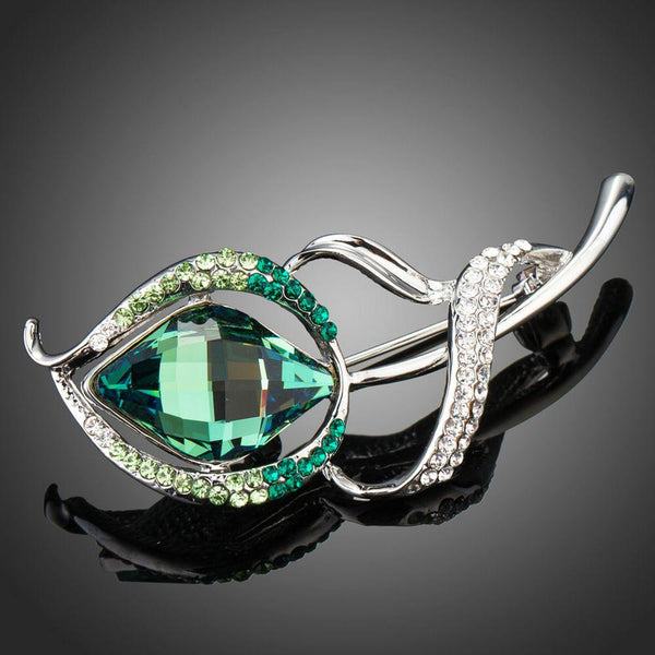 Khaista white gold green crystal flower brooch on white background