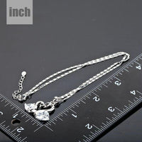 Pendant detail on KHAISTA white gold crystal goose necklace