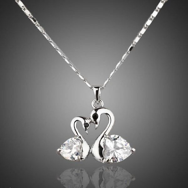 KHAISTA white gold crystal goose necklace on white background