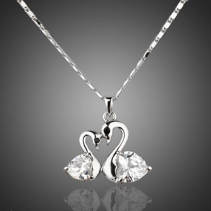 KHAISTA white gold crystal goose necklace on white background