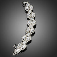 Close up detail of KHAISTA white gold CZ tennis bracelet