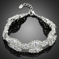 KHAISTA white gold CZ tennis bracelet on white background