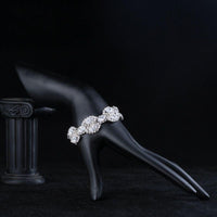 Side angle view of KHAISTA white gold CZ tennis bracelet