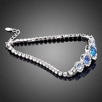 Close up detail of KHAISTA white gold navy blue crystal bracelet