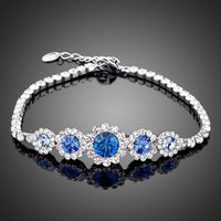 KHAISTA white gold navy blue crystal bracelet on white background
