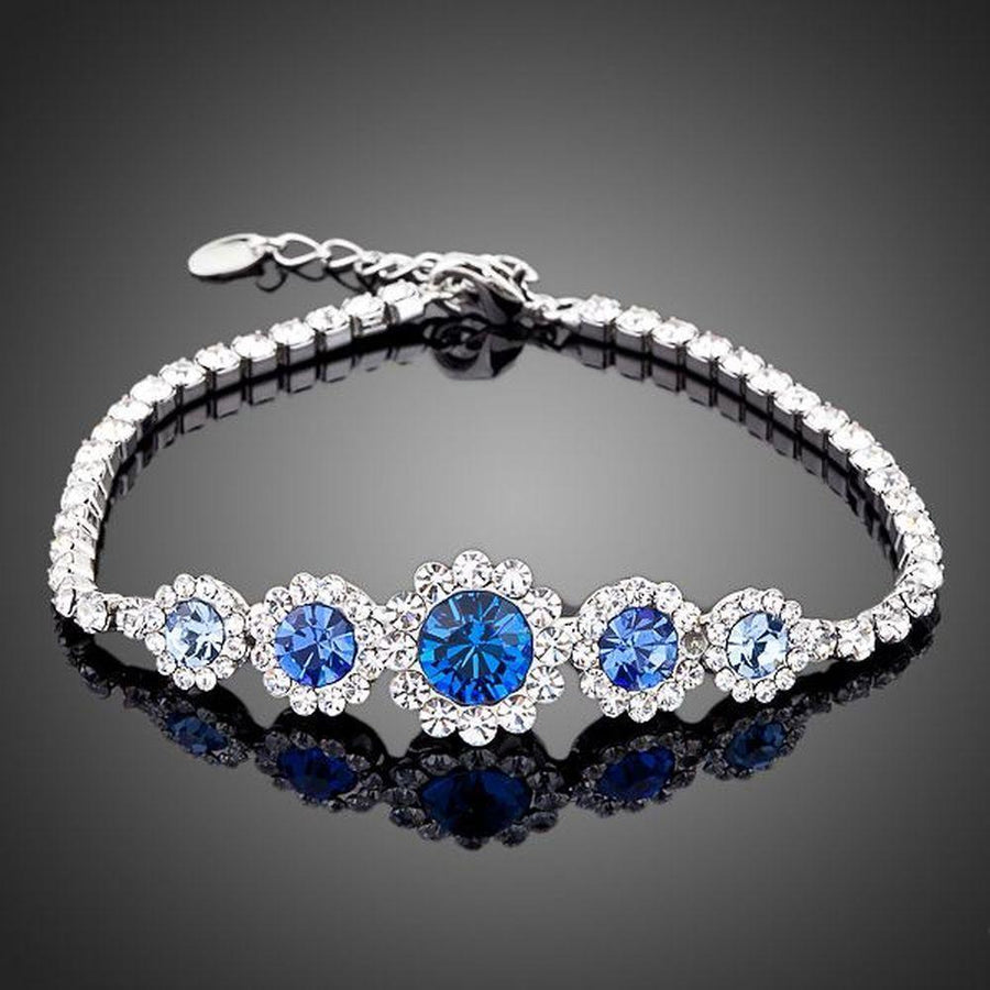 KHAISTA white gold navy blue crystal bracelet on white background