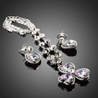 Side angle view of Khaista white gold heart flower set